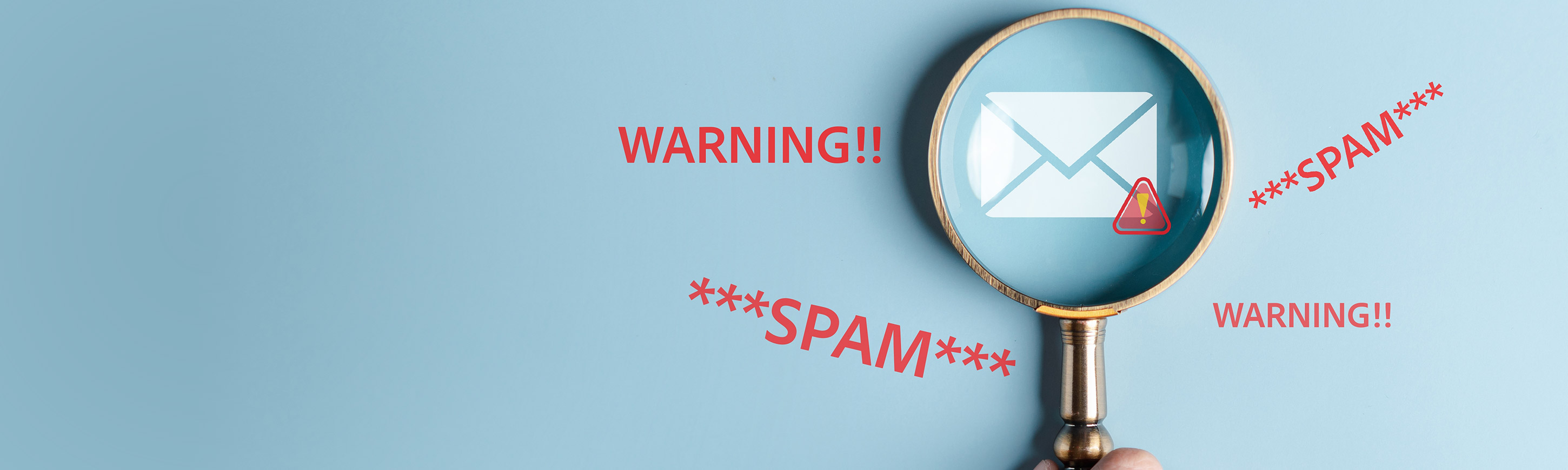 Image of a magnifying glass enlarging an envelope with a warning sign and the words: warning and spam