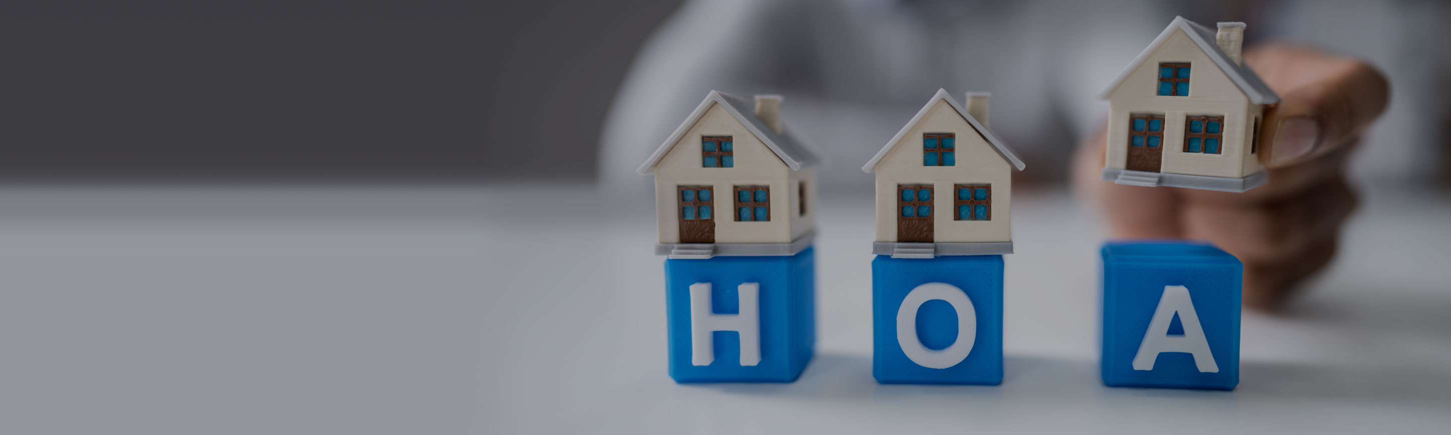 Blue letter blocks spelling out H O A