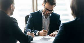 Business professional man signing documents