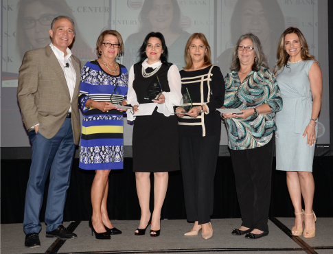 USCB female employees posing with their awards alongside uscb president luis de la aguilera and hr director jessica goldberg