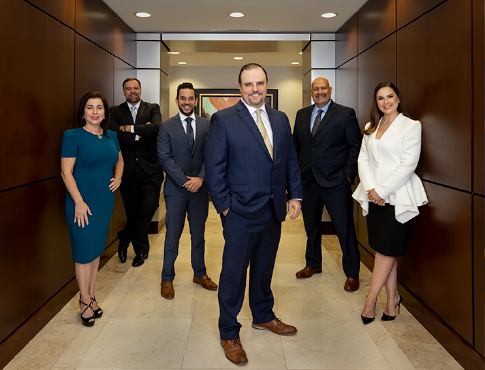 group of employees dressed in business attire standing in hallway