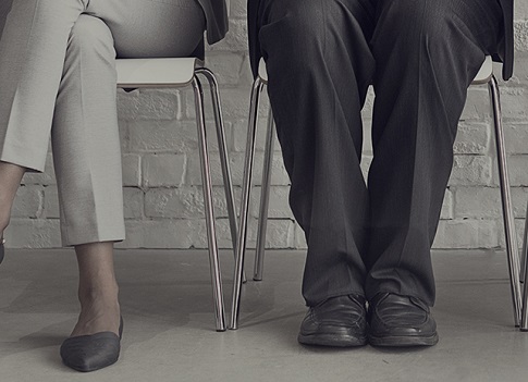 man and woman sitting down