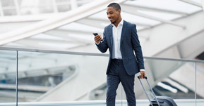 Business person walking through an airport