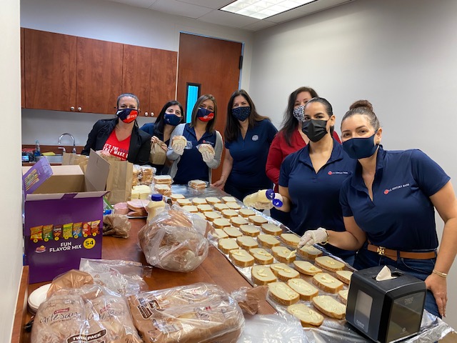 U.S. Century Bank employees making sandwiches