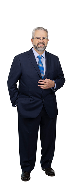 Full body photo of Chief Credit Officer Benigno Pazos